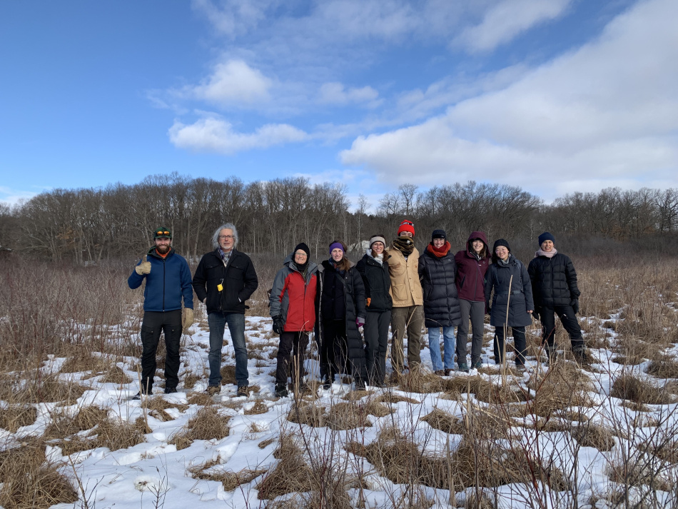 Group photo of project team and clients at the site from February 2022. From left to right: Spencer Kellum, Stephen Brown, Kris Olsson, Kim Heuman, Rachel Kaufmann, Liam Connolly, Alice Colville, Laura Gumpper, Xu Zhou, and Sheila Schueller  