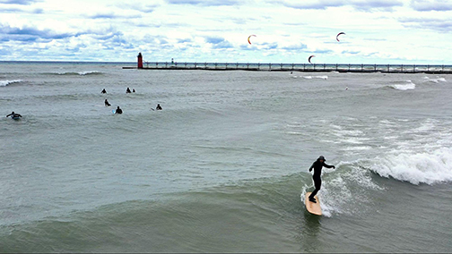 Carson Brown surfing on Lake Michigan.