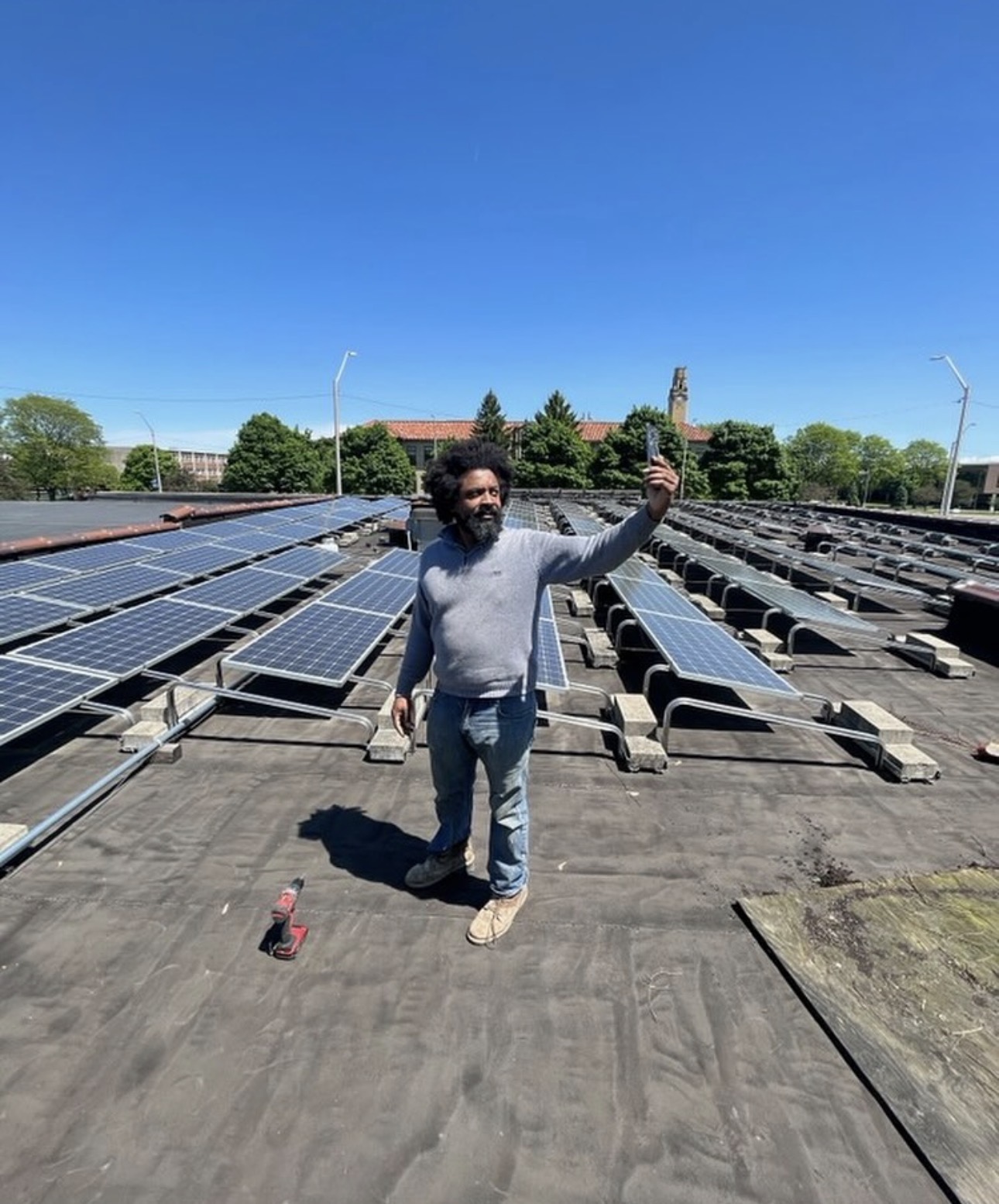 Jason Dixon, CEO of SACDC, stands on roof of their training facility building on Livernois in Detroit, MI