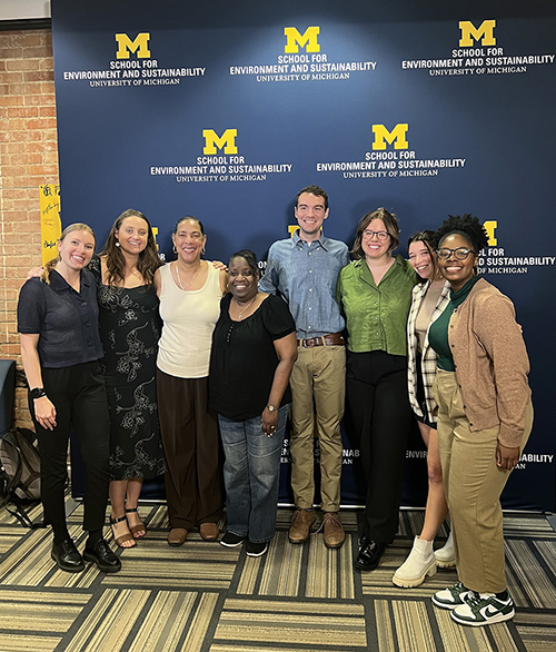 From left: Skyler Kriese, Ember McCoy, Theresa Landrum, Rhonda Anderson, John McClure, Megan Husted, Anna Bunting, and Dinah George at the students' master's project presentation in April. Photo courtesy of John McClure