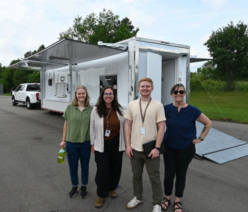Meredith King and others from the Ann Arbor Office of Sustainability and Innovations in front of the Sesame Solar Unit.