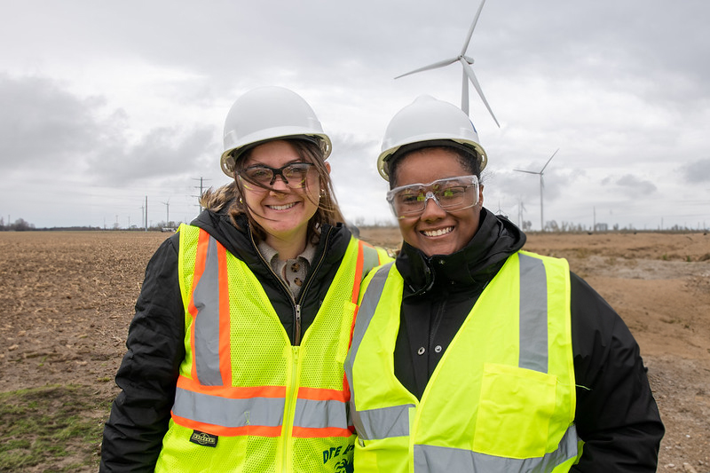 two SEAS Students at a wind farm wearing high vis vests and hard hats