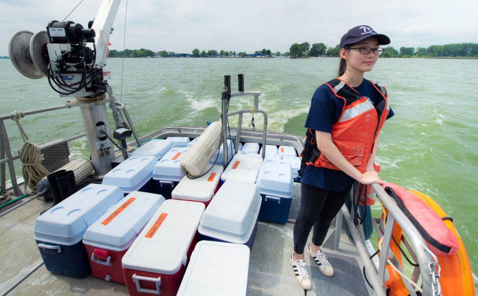 Graduate student, Hanqing Wu, heads out into Lake Erie on a field sampling cruise.