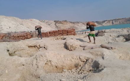 Bags of copper and cobalt are loaded by artisanal and small-scale miners near Kolwezi, DRC.