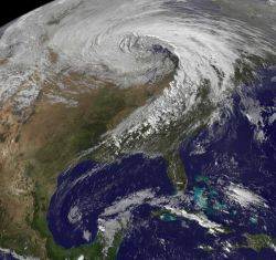 Extratropical cyclones, like the one centered above Minnesota in this satellite image from 2010, are bringing warmer and wetter air to the Great Lakes region in winter. Image credit: National Weather Service