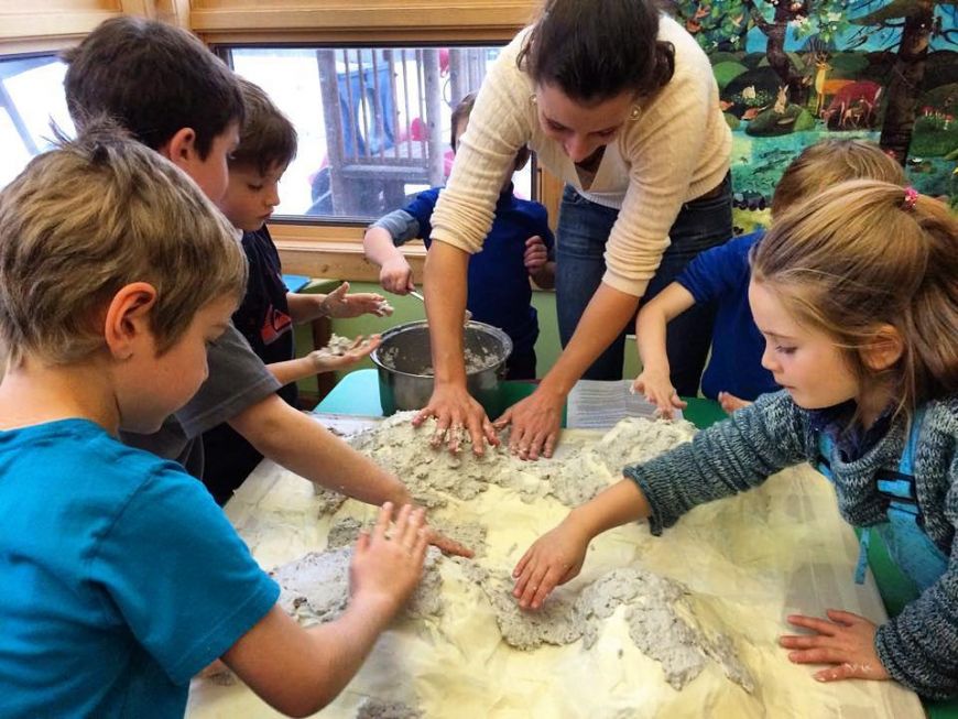 Slutzker teaches kids how to make a papier mache model of their local watershed. during her time as an AmeriCorps member in Montana