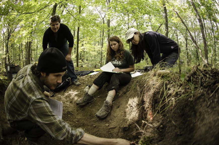 Professor Don Zak working with students in the field
