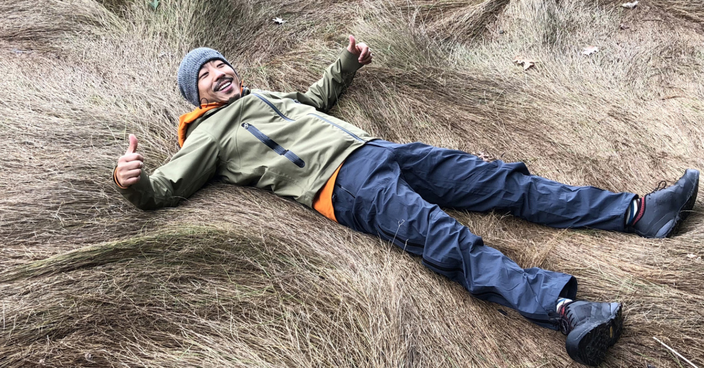 Tao Zhang laying in a field